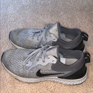 Gray and black Nike sneakers